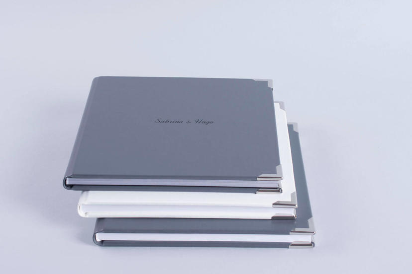 Exclusive embossed debossed text on the cover photo album gray grey material nphoto printing lab for professional photographers metal corners